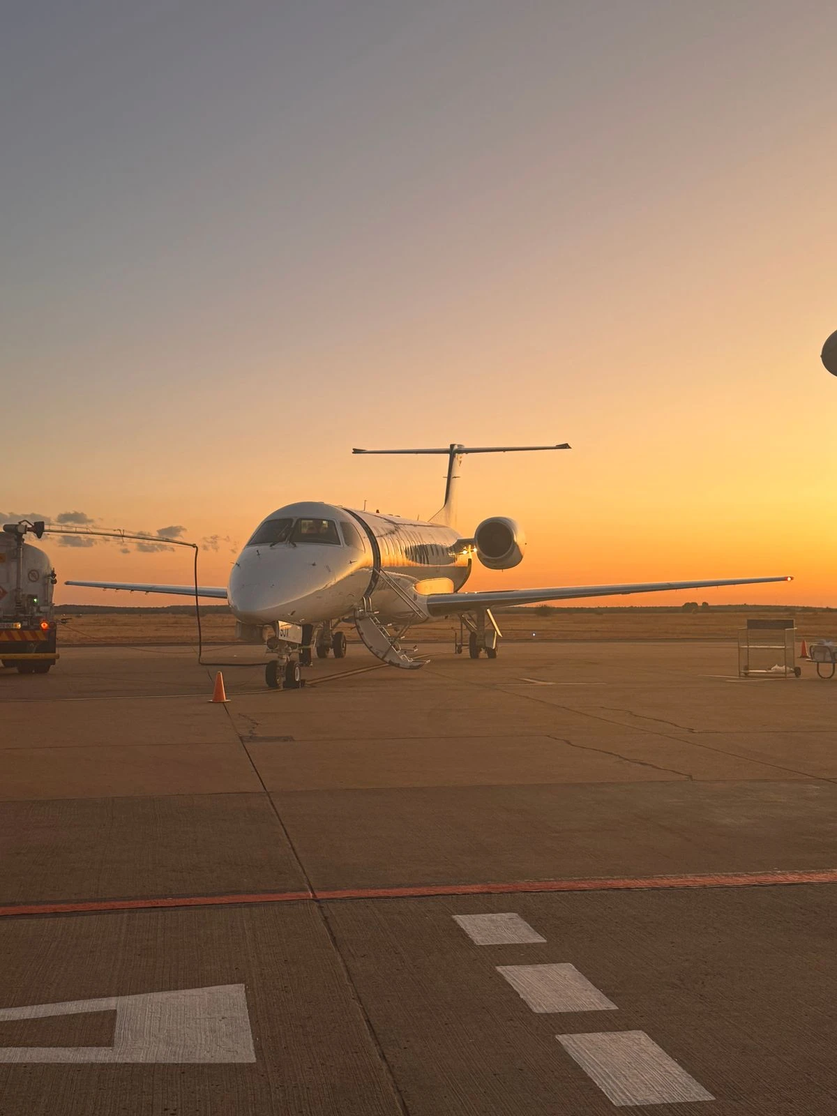 A private jet at sunset